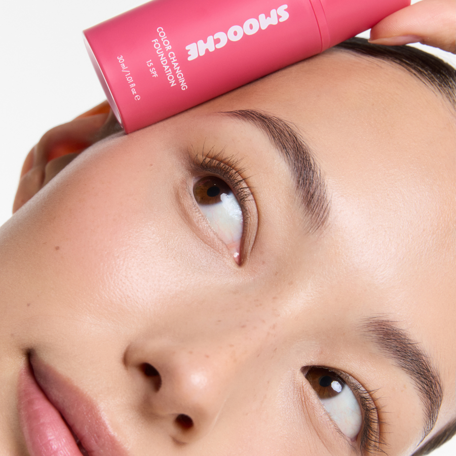 Woman holding the color changing foundation