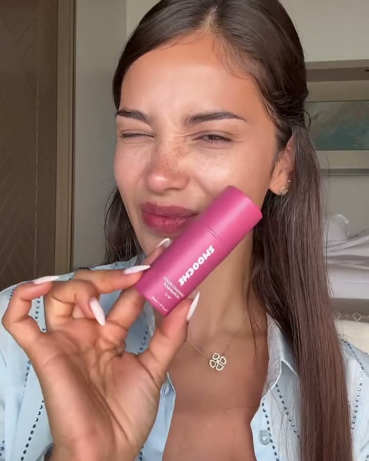 Woman holding Color Changing Foundation
