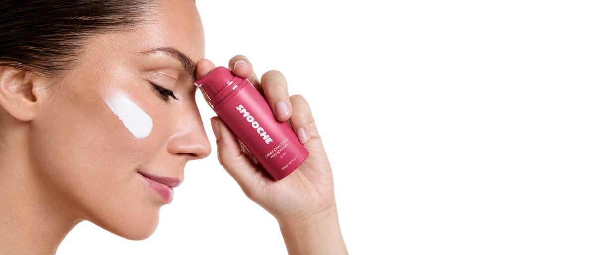 Woman applying Smooche foundation